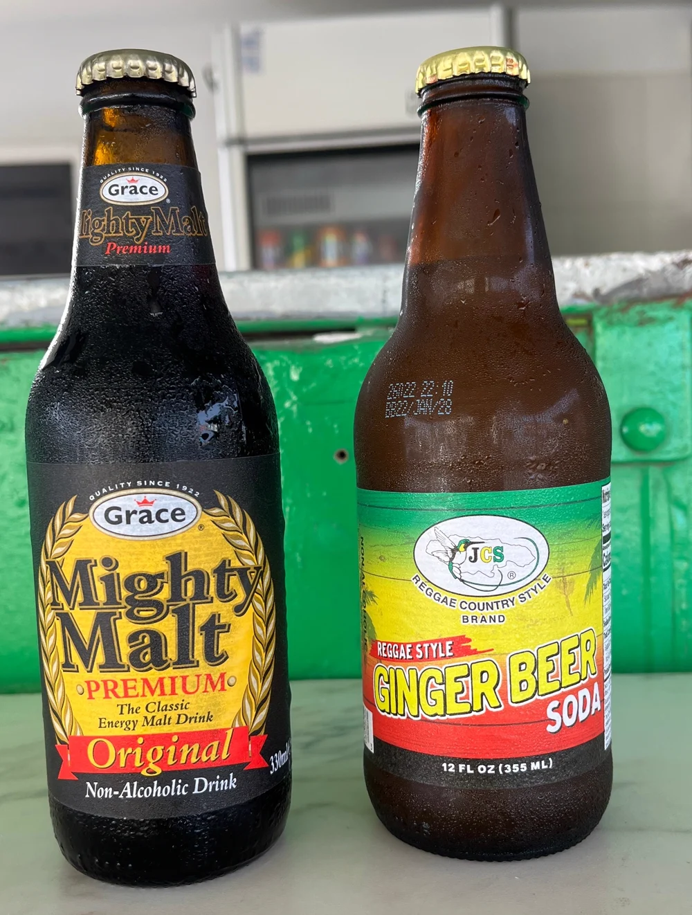 Grace Mighty Malt and JCS Reggae Style Ginger Beer, bottled Jamaican drinks on the counter at Reggae Vibes Takeaway