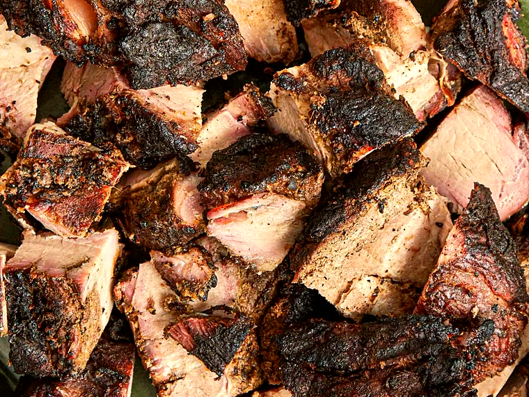 Smoky jerk pork over the coals